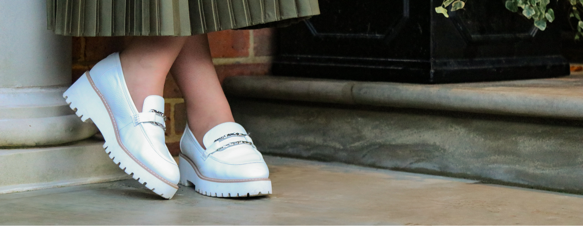 quality tights on lady with long skirt and white shoes